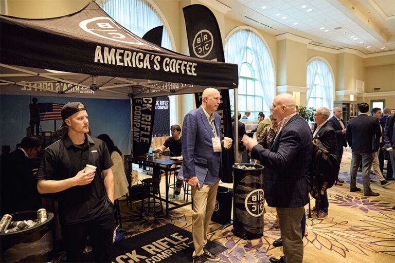 People gathered around America's Coffee tent